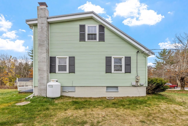 view of home's exterior featuring a yard