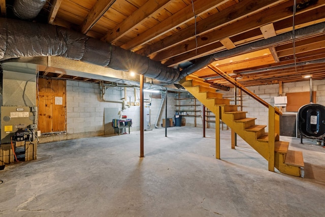 basement with water heater and heating unit