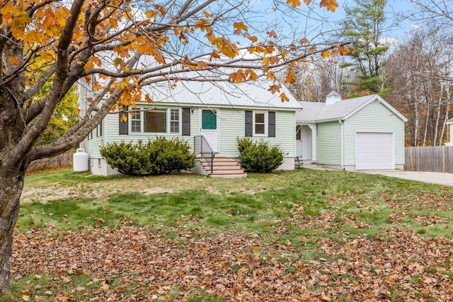 view of front facade with a garage and a front yard