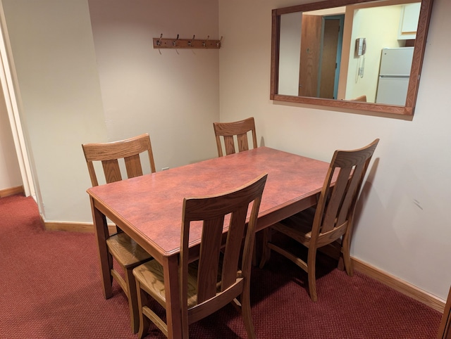 dining area featuring carpet