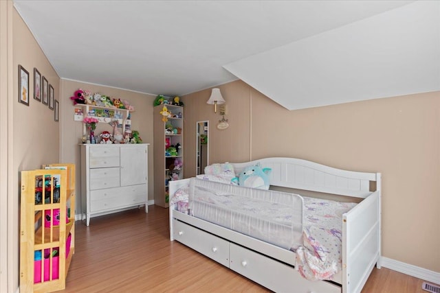 bedroom featuring wood-type flooring