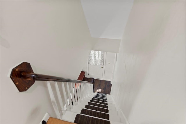 stairs with wood-type flooring