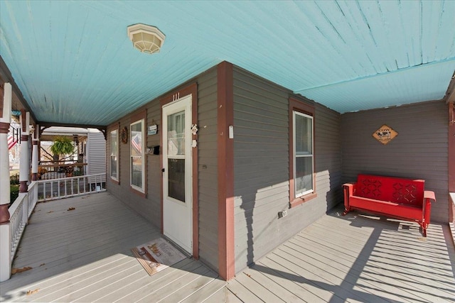 wooden terrace featuring a porch