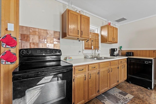 kitchen featuring black appliances, sink, and crown molding