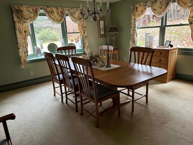 carpeted dining space with plenty of natural light and an inviting chandelier