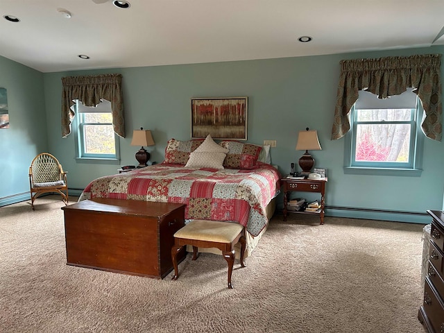 bedroom featuring carpet flooring and a baseboard heating unit