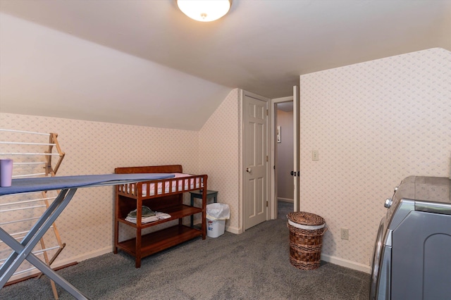 interior space featuring baseboards, vaulted ceiling, wallpapered walls, and carpet flooring