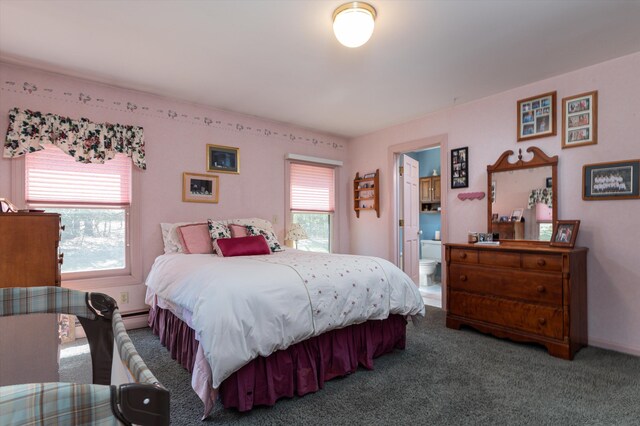 bedroom with carpet floors and connected bathroom
