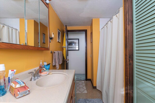 1319 Brandon Mountain Rd, Rochester, VT 05767 - full bathroom featuring vanity, tile patterned floors, a textured ceiling, a closet, and curtained shower