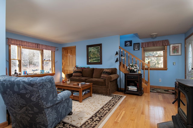 1319 Brandon Mountain Rd, Rochester, VT 05767 - living area with stairway, light wood-style floors, and baseboards