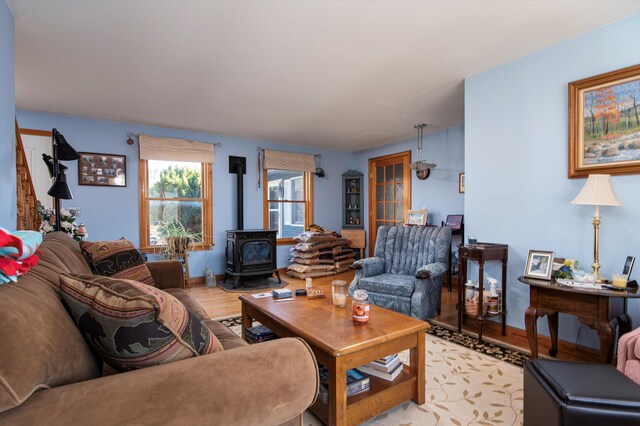 1319 Brandon Mountain Rd, Rochester, VT 05767 - living room featuring a wood stove and light wood finished floors