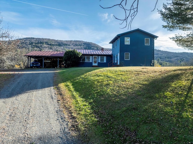 1319 Brandon Mountain Rd, Rochester, VT 05767 - view of front facade featuring a carport, a front yard, dirt driveway, and metal roof