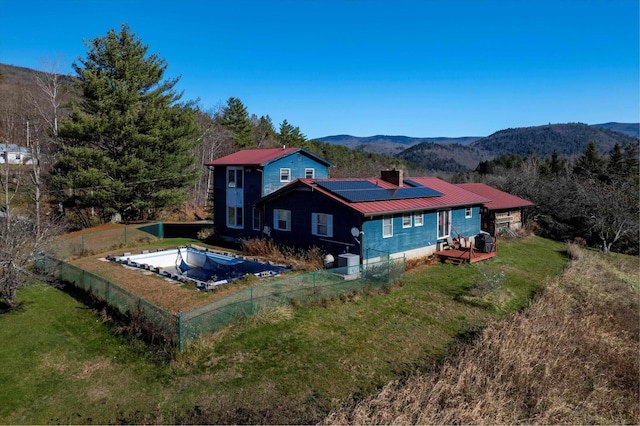 1319 Brandon Mountain Rd, Rochester, VT 05767 - back of house with solar panels, metal roof, and a deck with mountain view