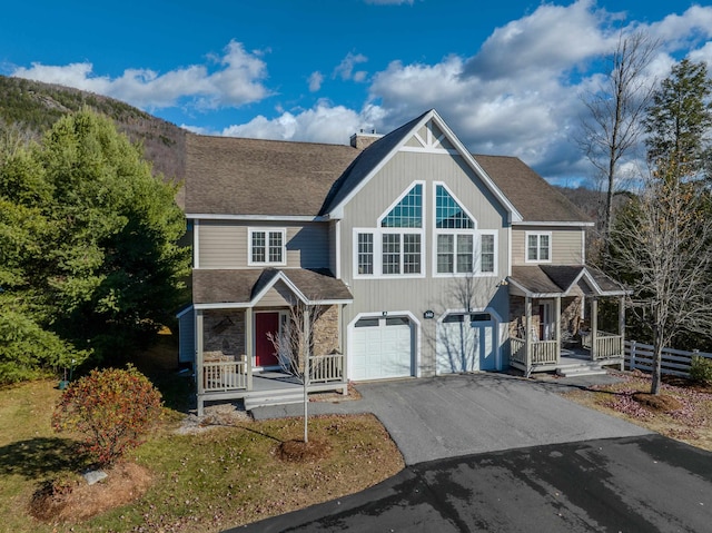 view of front of home with a porch and a garage