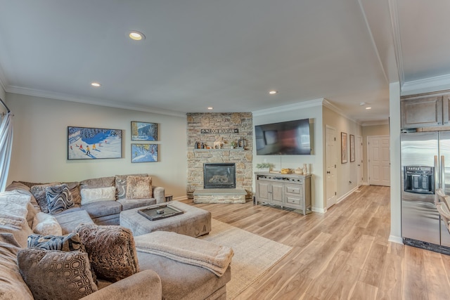 living room with a stone fireplace, light hardwood / wood-style floors, and ornamental molding