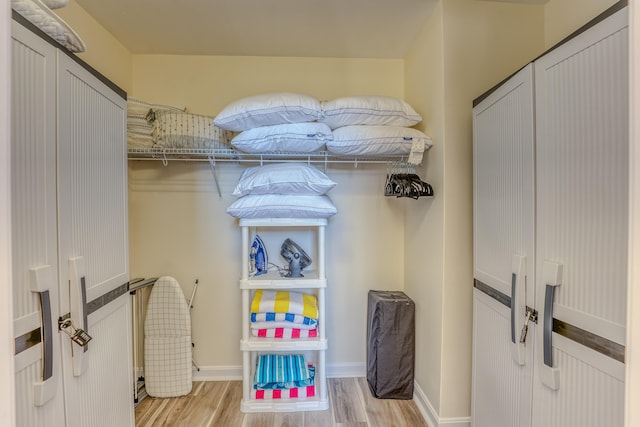 walk in closet featuring light wood-type flooring