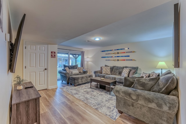 living room with light hardwood / wood-style flooring