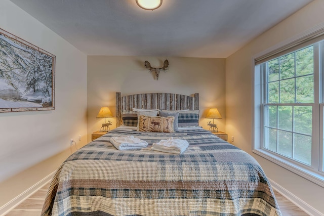 bedroom with wood-type flooring