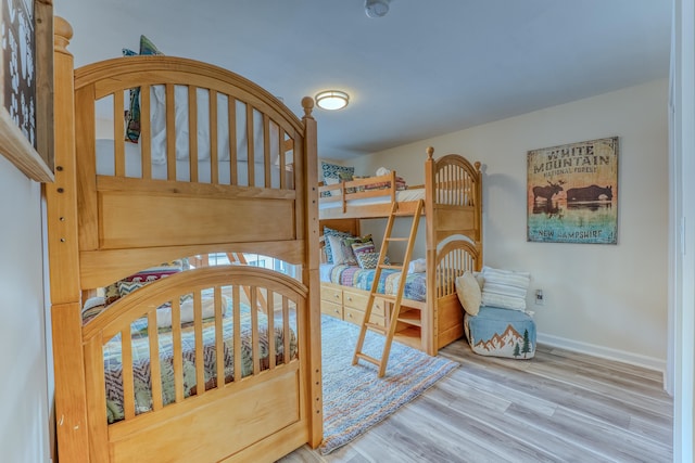 bedroom with wood-type flooring