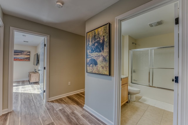 hallway featuring light hardwood / wood-style flooring