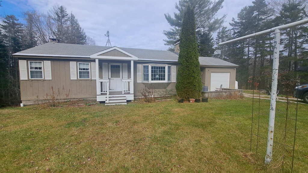 view of front of home featuring a garage and a front yard