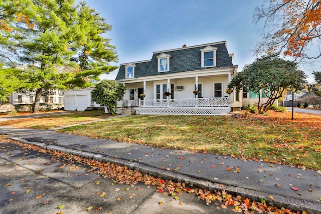 view of front of house with an outdoor structure and a porch