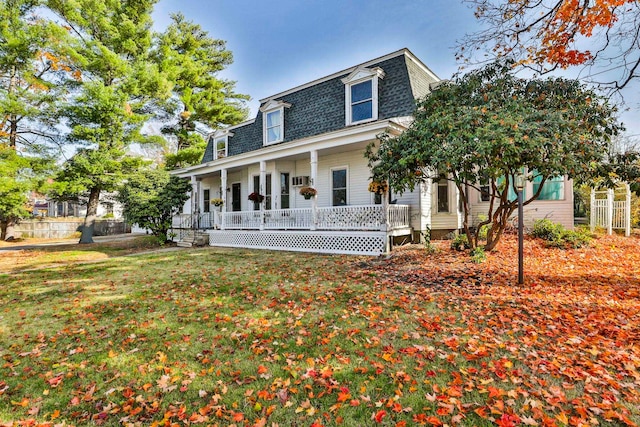 view of front of house featuring a porch and a front lawn