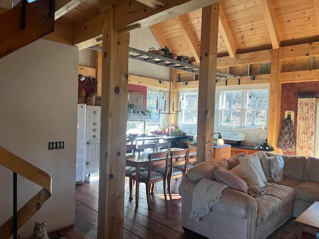 living room featuring vaulted ceiling with beams, dark hardwood / wood-style flooring, and wood ceiling