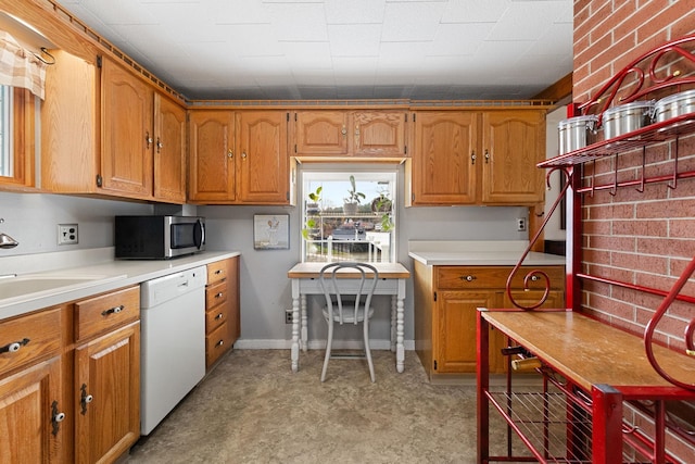 kitchen featuring sink and white dishwasher