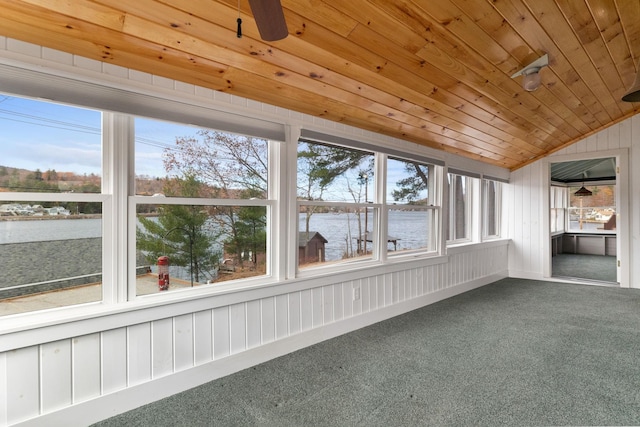 unfurnished sunroom with a water view, vaulted ceiling, and wood ceiling