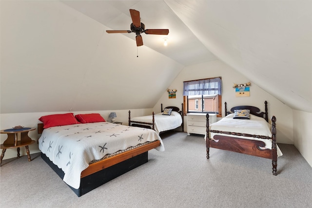 carpeted bedroom featuring vaulted ceiling and ceiling fan