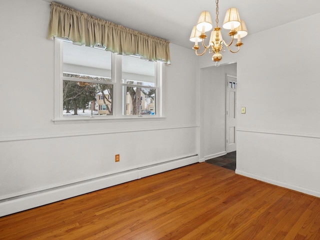 67 Case Pkwy, Burlington, VT 05401 - unfurnished dining area featuring a chandelier, wood finished floors, a baseboard heating unit, and baseboards