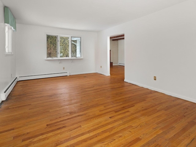 67 Case Pkwy, Burlington, VT 05401 - unfurnished room featuring wood finished floors, baseboard heating, and baseboards