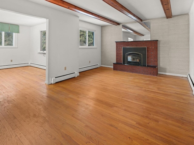 67 Case Pkwy, Burlington, VT 05401 - unfurnished living room featuring wood finished floors, beamed ceiling, a baseboard radiator, and a brick fireplace