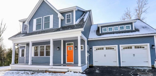 view of front of house featuring a garage and covered porch