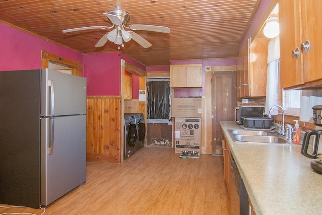 43 Maple St, Orleans, VT 06860 - kitchen featuring freestanding refrigerator, wood ceiling, washing machine and dryer, a sink, and a ceiling fan