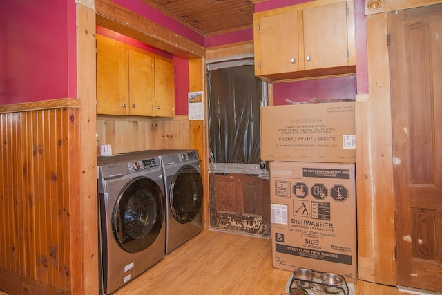 43 Maple St, Orleans, VT 06860 - laundry room featuring cabinet space, washing machine and dryer, and light wood-style flooring