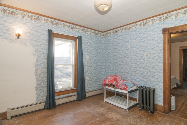 43 Maple St, Orleans, VT 06860 - rec room featuring radiator, ornamental molding, wood finished floors, and wallpapered walls