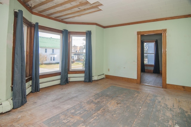 43 Maple St, Orleans, VT 06860 - unfurnished room with wood finished floors, a baseboard heating unit, and baseboards