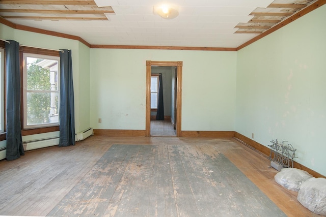 43 Maple St, Orleans, VT 06860 - empty room with wood-type flooring, baseboards, and crown molding