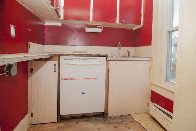 43 Maple St, Orleans, VT 06860 - kitchen with white dishwasher, concrete flooring, a sink, and light countertops