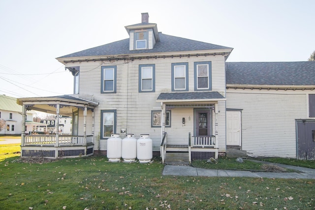 43 Maple St, Orleans, VT 06860 - rear view of house featuring a lawn, a chimney, a deck, and roof with shingles