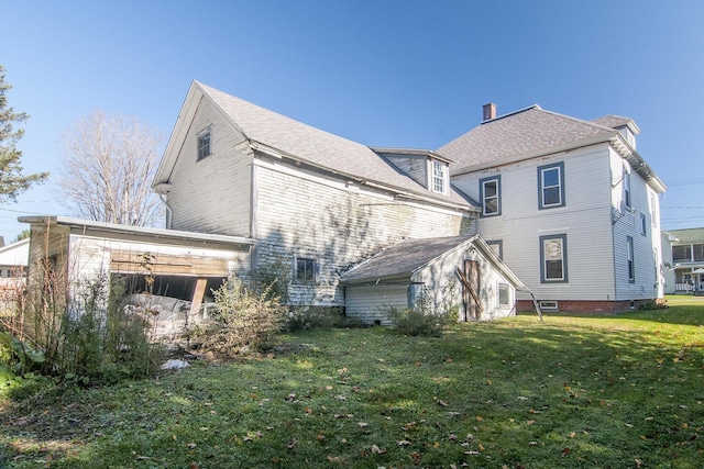 43 Maple St, Orleans, VT 06860 - rear view of house featuring a yard