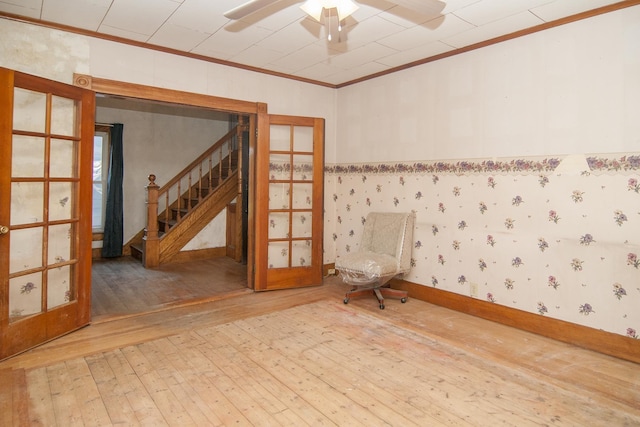 43 Maple St, Orleans, VT 06860 - spare room featuring a ceiling fan, hardwood / wood-style flooring, ornamental molding, and stairs