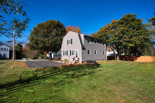 back of house featuring a yard and a patio area