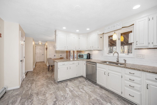 kitchen featuring kitchen peninsula, sink, and white cabinets