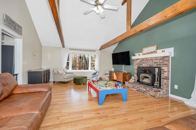 living room featuring high vaulted ceiling, hardwood / wood-style floors, ceiling fan, and beam ceiling