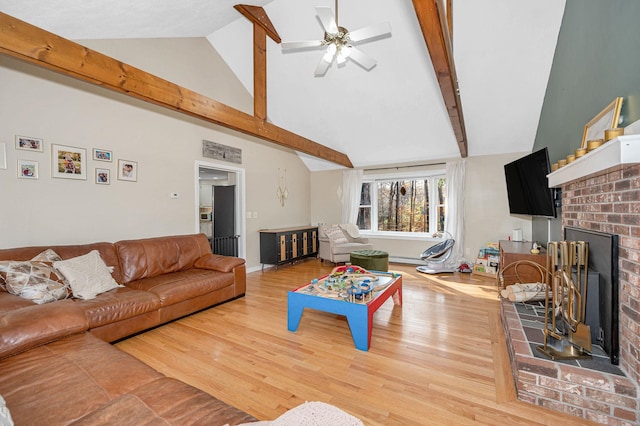 living room with a brick fireplace, high vaulted ceiling, hardwood / wood-style flooring, a baseboard radiator, and ceiling fan