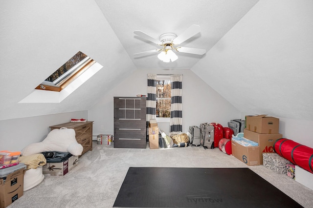 additional living space with lofted ceiling, carpet flooring, and ceiling fan