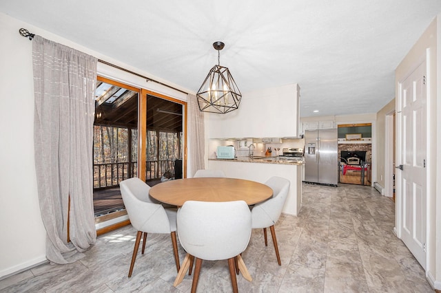 dining room with an inviting chandelier and sink